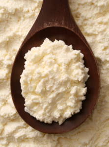 ricotta cheese in wooden spoon